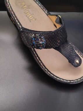 Alegria Black Iridescent Thong Sandals with Decorative Medallion